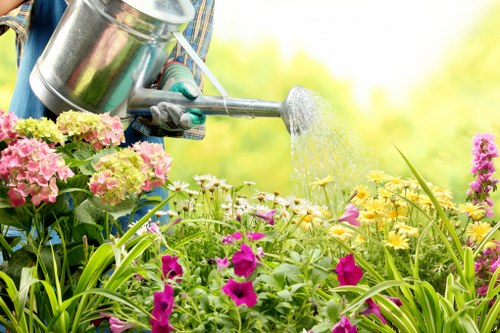 Team member using protective equipment during gardening tasks
