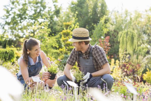 Trained gardener completing maintenance with awareness of site risks